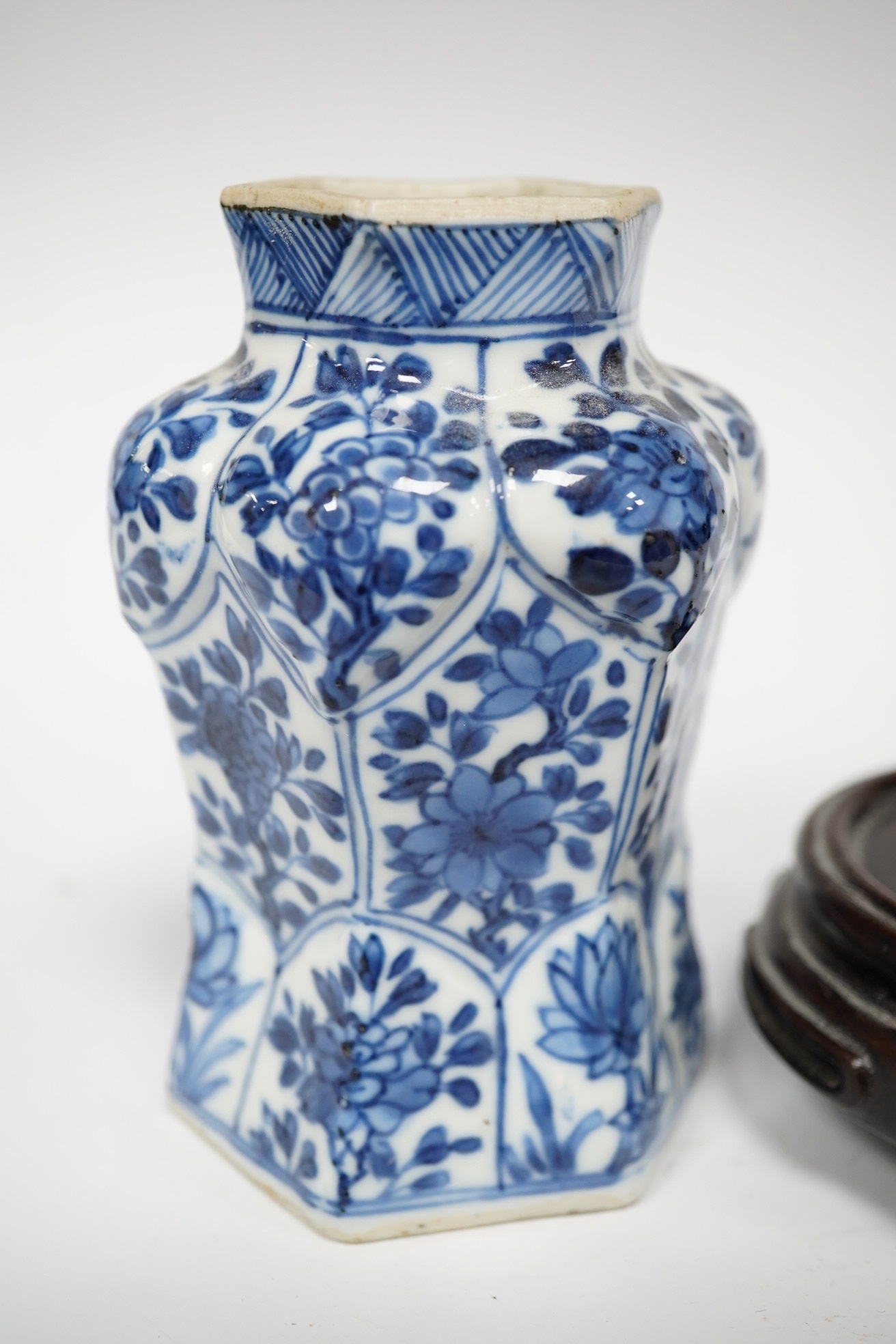 A Chinese blue and white hexagonal jar, Kangxi period and stand, 10cm high. Condition -small firing crack to inside edge of foot, otherwise good